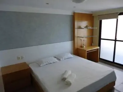 Uma cama ou camas num quarto em Apartamento vista mar