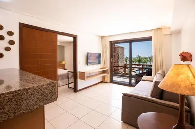 Uma área de estar em [KaririBeach319] Incrível Flat 2qts à beira-mar