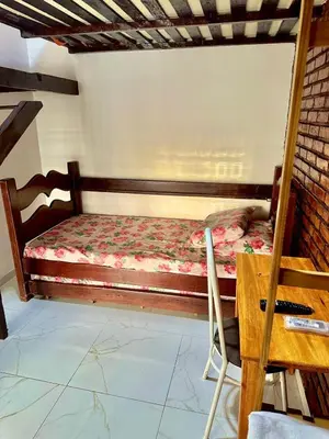 Uma cama ou camas num quarto em Home Beach Mar Conforto Self-Hosted