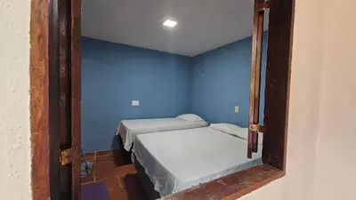 Uma cama ou camas num quarto em Chalé Verdelândia Guaramiranga - Apartamento com 2 quartos