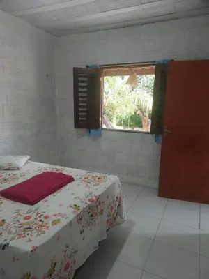 Uma cama ou camas num quarto em Chalés Catim da Felicidade
