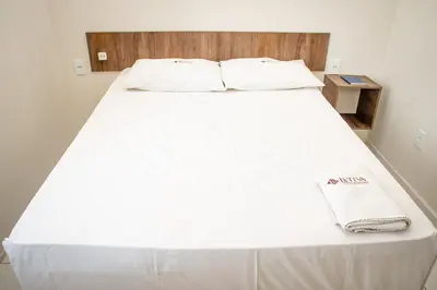 Uma cama ou camas num quarto em Hotel Letiva Centro