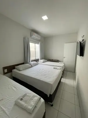 Uma cama ou camas num quarto em Hotel Letiva Centro