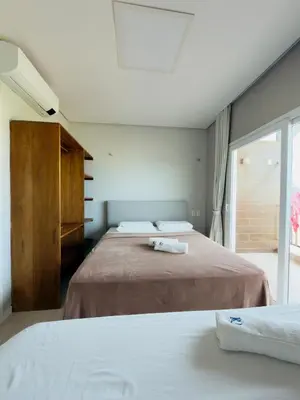 Uma cama ou camas num quarto em Duplex Premium Vista Mar e piscina Canoa Quebrada 12 pessoas