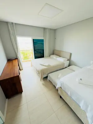 Uma cama ou camas num quarto em Duplex Premium Vista Mar e piscina Canoa Quebrada 12 pessoas