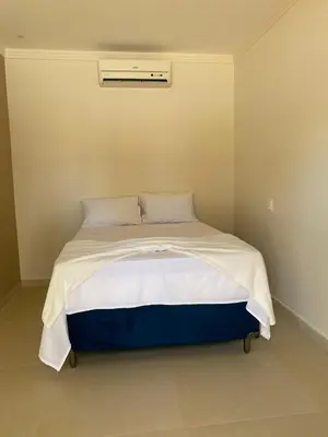 Uma cama ou camas num quarto em Pousada Vibe Guajiru