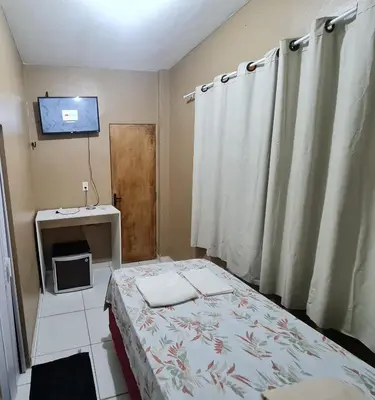 Uma cama ou camas num quarto em Pousada Meireles Praia