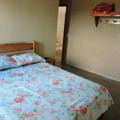 Uma cama ou camas num quarto em Pousada Fernandes