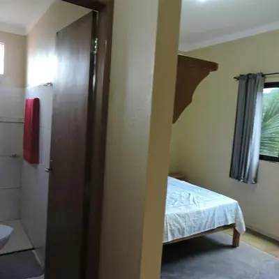 Uma cama ou camas num quarto em Pousada Fernandes