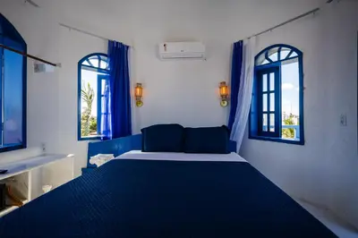 Uma cama ou camas num quarto em Pousada TRIBUS experience