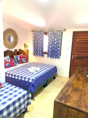 Uma cama ou camas num quarto em Maria Flor Pousada
