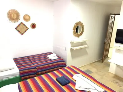 Uma cama ou camas num quarto em Maria Flor Pousada