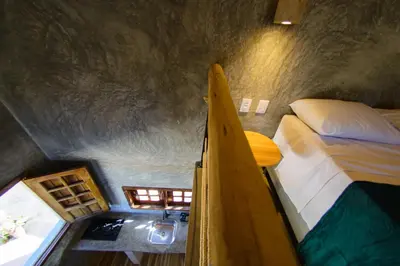 Uma cama ou camas num quarto em Pousada Carcará