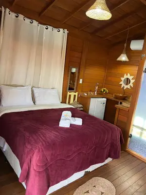 Uma cama ou camas num quarto em Pousada BANGALÔS SOL DE LAGOINHA