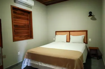 Uma cama ou camas num quarto em Lyttos Bungalows