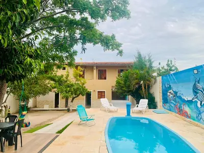 A piscina em ou perto de Happy Hostel e Pousada Paracuru