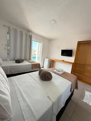Uma cama ou camas num quarto em Milano Hotel Pousada Canoa Quebrada