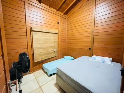 Uma cama ou camas num quarto em Casa de Madeira 700 Serra Meruoca