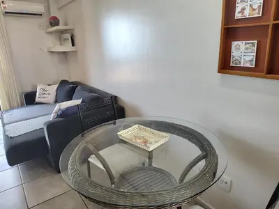Uma área de estar em Meireles Família LC FLATS 1307