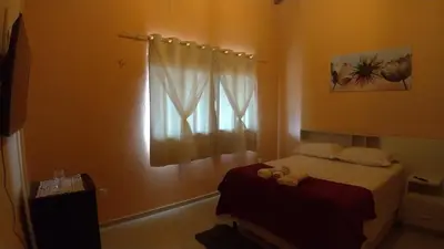 Uma cama ou camas num quarto em Belaninha