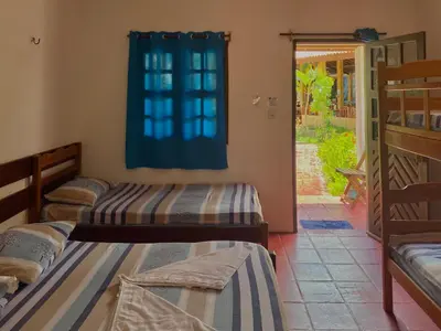 Uma cama ou camas num quarto em Pousada Paraiso Verão