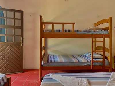 Uma cama ou camas num quarto em Pousada Paraiso Verão