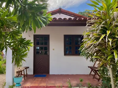 Um jardim no exterior de Pousada Paraiso Verão