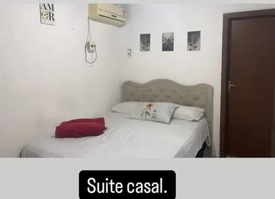 Uma cama ou camas num quarto em Pousada Carimbó