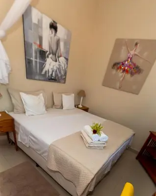 Uma cama ou camas num quarto em Pousada Vila Canoa