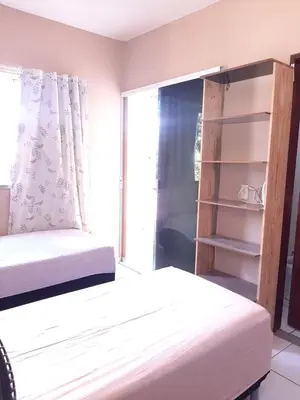 Uma cama ou camas num quarto em Duplex Arretadinho