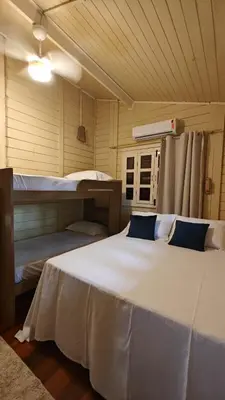 Uma cama ou camas num quarto em CASA MIRAGE lagoa
