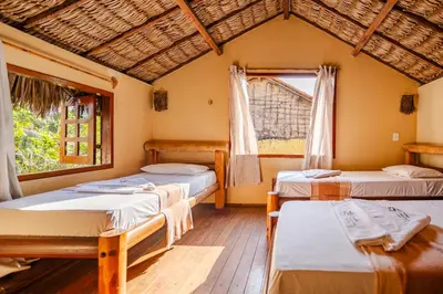 Uma cama ou camas num quarto em Pousada Chale Creoulo