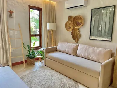 Uma área de estar em Taíba Beach Resort por Be My Guest!