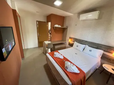 Uma cama ou camas num quarto em Cidade Jardim Apart