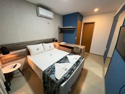 Uma cama ou camas num quarto em Cidade Jardim Apart