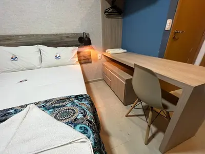 Uma cama ou camas num quarto em Cidade Jardim Apart