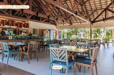 Um restaurante ou outro lugar para comer em Bangalô frente jardim no VG Sun Cumbuco por Tactu