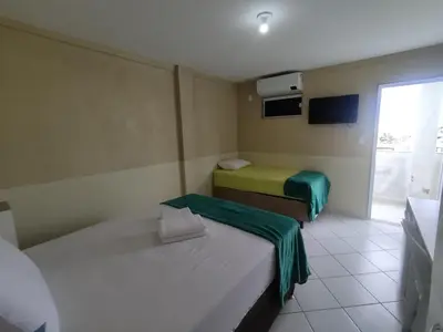 Uma cama ou camas num quarto em Amazônia Praia Hotel