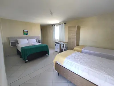 Uma cama ou camas num quarto em Amazônia Praia Hotel