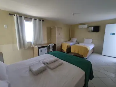 Uma cama ou camas num quarto em Amazônia Praia Hotel
