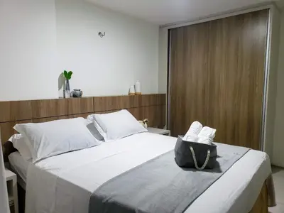 Uma cama ou camas num quarto em Apartamento pé na areia com jacuzzi - 3 quartos - 7 hóspedes - Beach Park