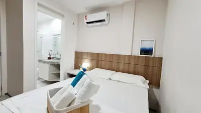 Uma cama ou camas num quarto em Apartamento pé na areia com jacuzzi - 3 quartos - 7 hóspedes - Beach Park