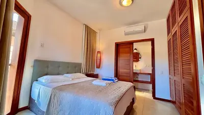 Uma cama ou camas num quarto em Dream Beach Cumbuco Superior Oceanfront Apartments